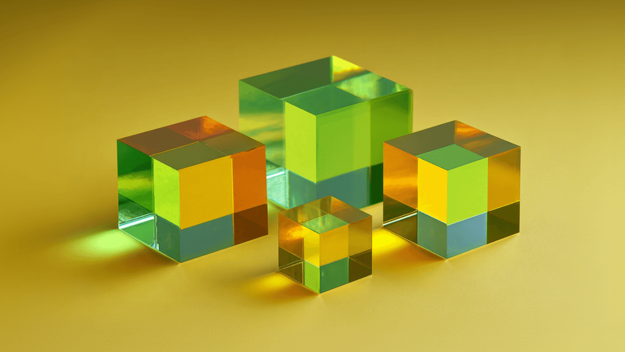 Four polarizing beamsplitter cubes in yellow and green color.