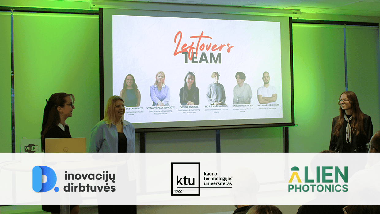 KTU students presenting their solution for Alien Photonics during the Inovacijų Dirbtuvės finals, with Inovacijų Dirbtuvės, Kaunas University of Technology and Alien Photonics logos visible.
