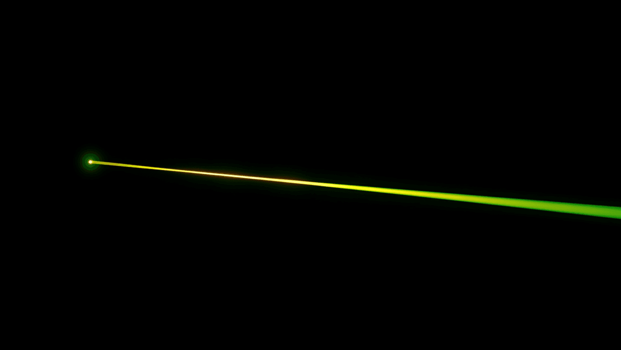 Laser beam fading from green to yellow